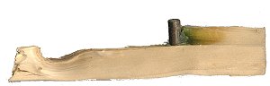 Il proiettile nel ceppo di legno